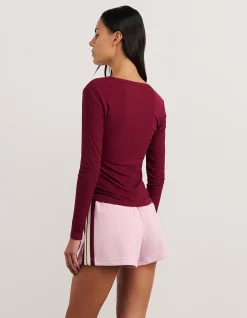 CELINA HENLEY LONG SLEEVE TOP